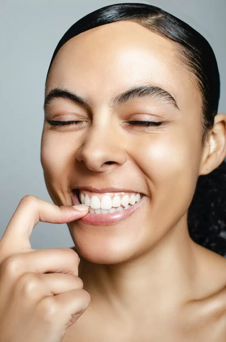 a woman with a toothbrush in her mouth